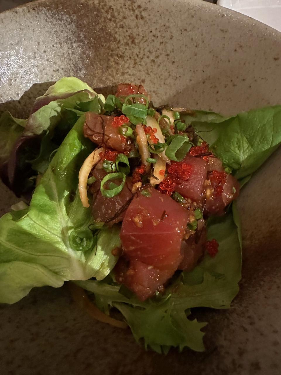 The poke bowl, finely-diced raw tuna in a bed of lettuce and rice with other fixings, is one of the staples of the Hawaiian culinary tradition. (Adam Schupak/Golfweek)