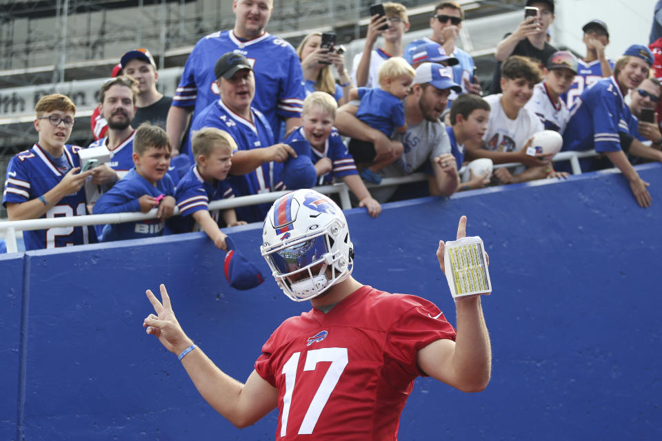 Buffalo Bills quarterback Josh Allen (17) takes the field before practice at NFL football training camp in Orchard Park, N.Y., on Saturday, July 31, 2021. (AP Photo/Joshua Bessex)