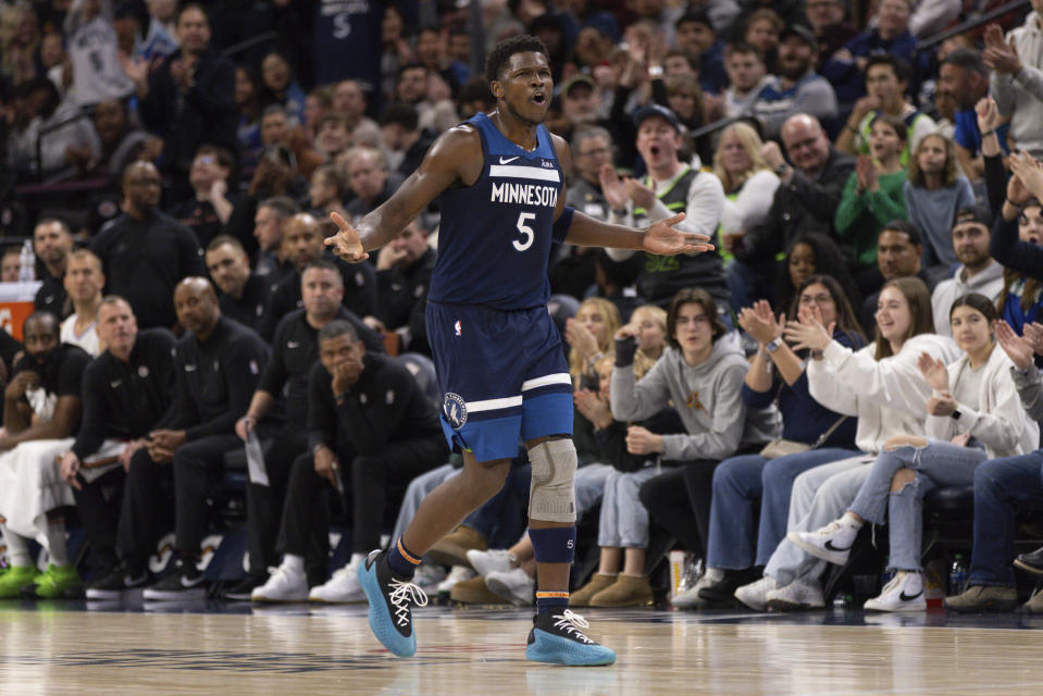 Minnesota Timberwolves guard Anthony Edwards (5) celebrates after making a 3-point basket during the second half of an NBA basketball game against the Los Angeles Clippers, Sunday, Jan. 14, 2024, in Minneapolis. (AP Photo/Bailey Hillesheim)