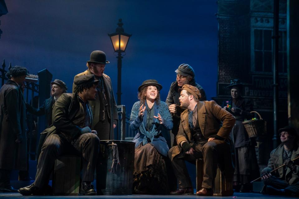 One of the street scenes from Lerner & Loewe’s “My Fair Lady,” presented at the Aronoff Center by Broadway in Cincinnati. From left, Shavey Brown, Mark Aldrich, Shereen Ahmed portraying Eliza Doolittle, William Michals and Colin Anderson.