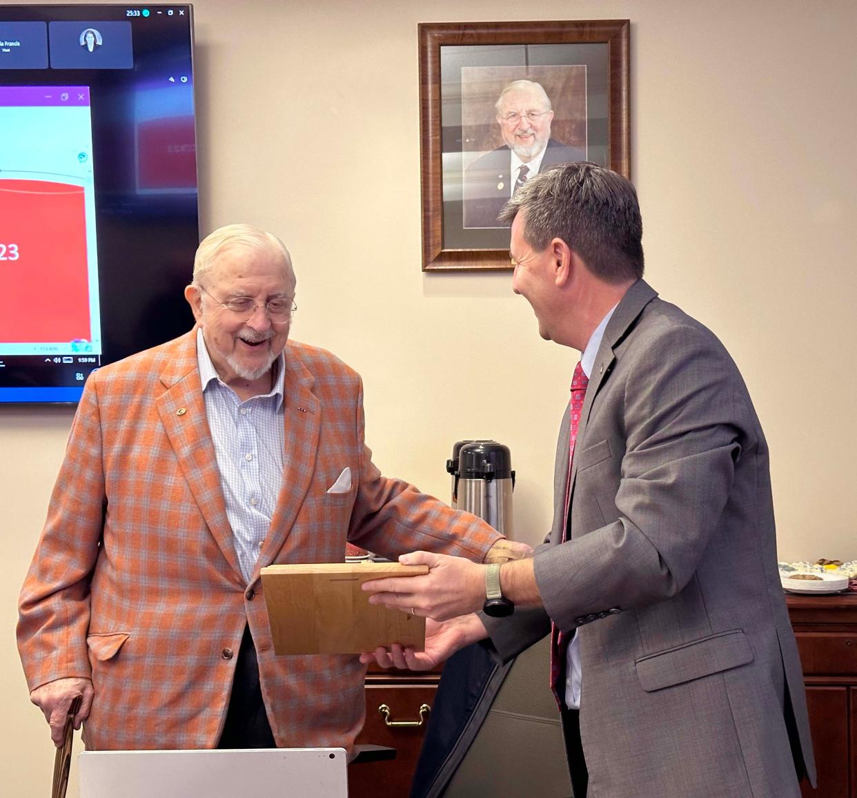 Former Canandaigua National Bank President and Board Chairman George W. Hamlin IV is recognized for 45 years of leadership by having the bank's boardroom named after him.