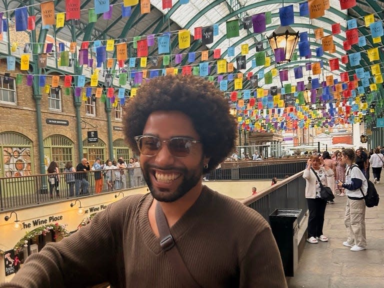 malik posing for a photo in covent garden in london