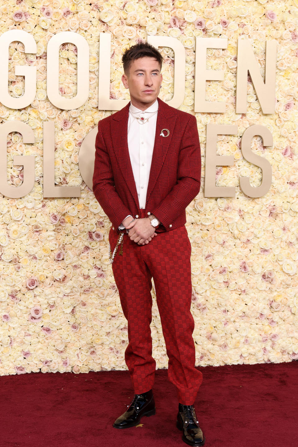"Saltburn" star Barry Keoghan went against the grain in a patterned red look by Louis Vuitton. (Image via Getty Images)