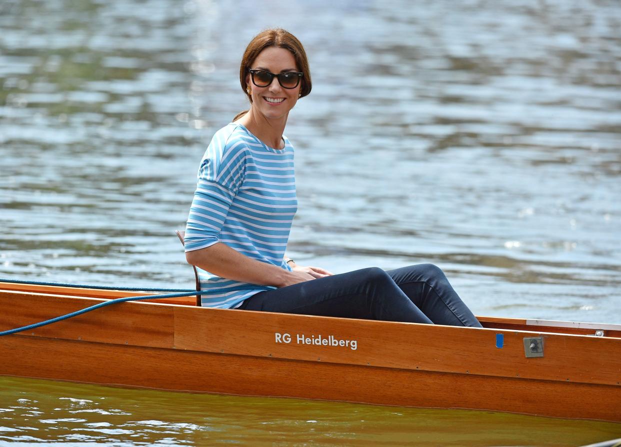 Catherine, Duchess of Cambridge competes against Prince William, Duke of Cambridge as they cox rowing boats in a friendly race between the twinned town of Cambridge and Heidelberg on the Neckar River during the second day of their visit to Germany in 2017