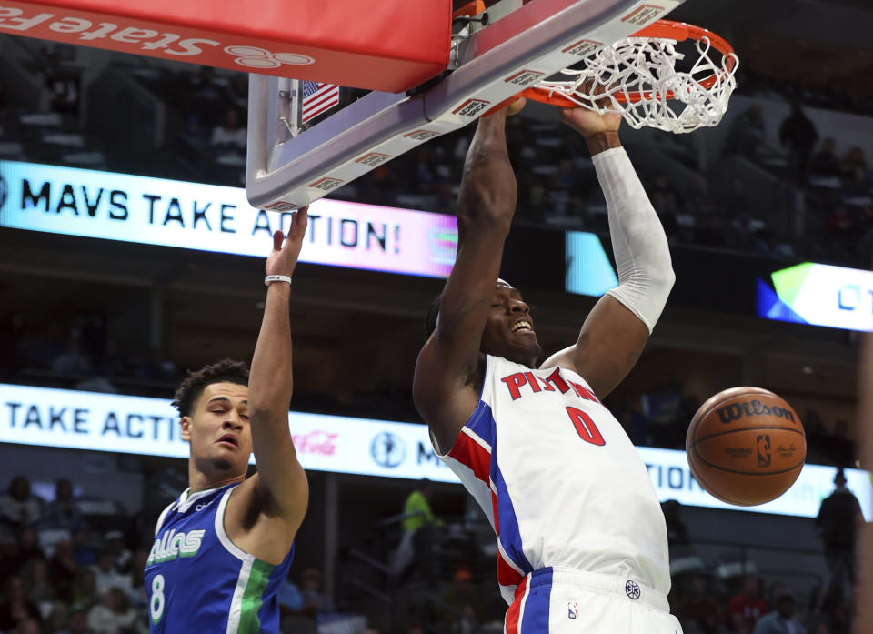 Detroit Pistons center Jalen Duren (0) dunks over against Dallas Mavericks guard Josh Green (8) in the first half of an NBA basketball game Monday, Jan. 30, 2023, in Dallas. (AP Photo/Richard W. Rodriguez)