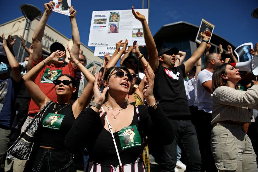 SHERMAN OAKS, CA - SEPTEMBER 25: Hundreds of people gather in front of the Sherman Oaks Galleria in memory of Mahsa Amini, 22, who died in police custody after allegedly being arrested for violating Iran's hijab rules, on Sunday, Sept. 25, 2022 in Sherman Oaks, CA. (Gary Coronado / Los Angeles Times)