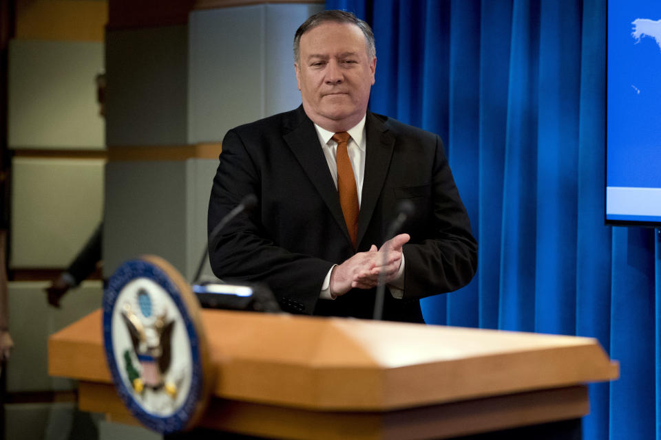 Secretary of State Mike Pompeo arrives to speak at a news conference in the press briefing room at the State Department in Washington, Friday, Sept. 14, 2018, in Washington. Pompeo says his Obama-era predecessor John Kerry has been 'actively undermining' U.S. policy on Iran. (AP Photo/Andrew Harnik)