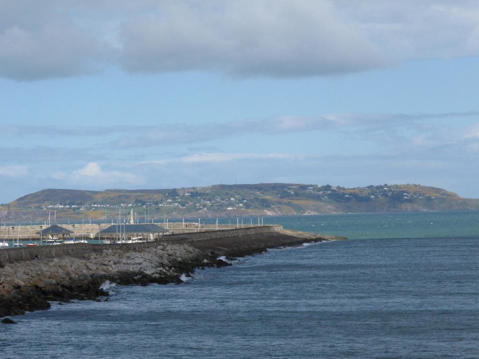 In this May 13, 2013 photo shows a view from the pier in Dun Laoghaire, a port town in County Dublin, Ireland where thousands of young Irish emigrated to Britain during the 1950s and 1960s. As part of The Gathering, a yearlong event in Ireland to bring its diaspora home, a group of volunteers sponsored about 50 elderly emigrants on a weeklong visit, including an emotional wreath-laying ceremony next to a plaque in their honor on the pier. (AP Photo/Helen O'Neill)