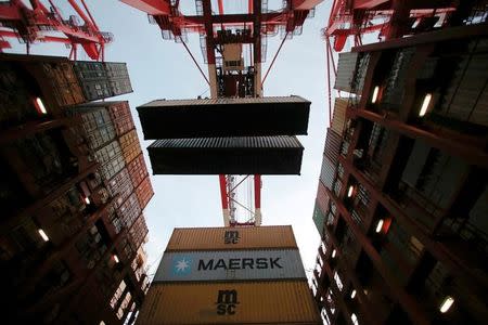 FILE PHOTO: Containers are seen unloaded from the Maersk's Triple-E giant container ship Maersk Majestic at the Yangshan Deep Water Port, part of the Shanghai Free Trade Zone, in Shanghai, China, September 24, 2016. REUTERS/Aly Song/File Photo