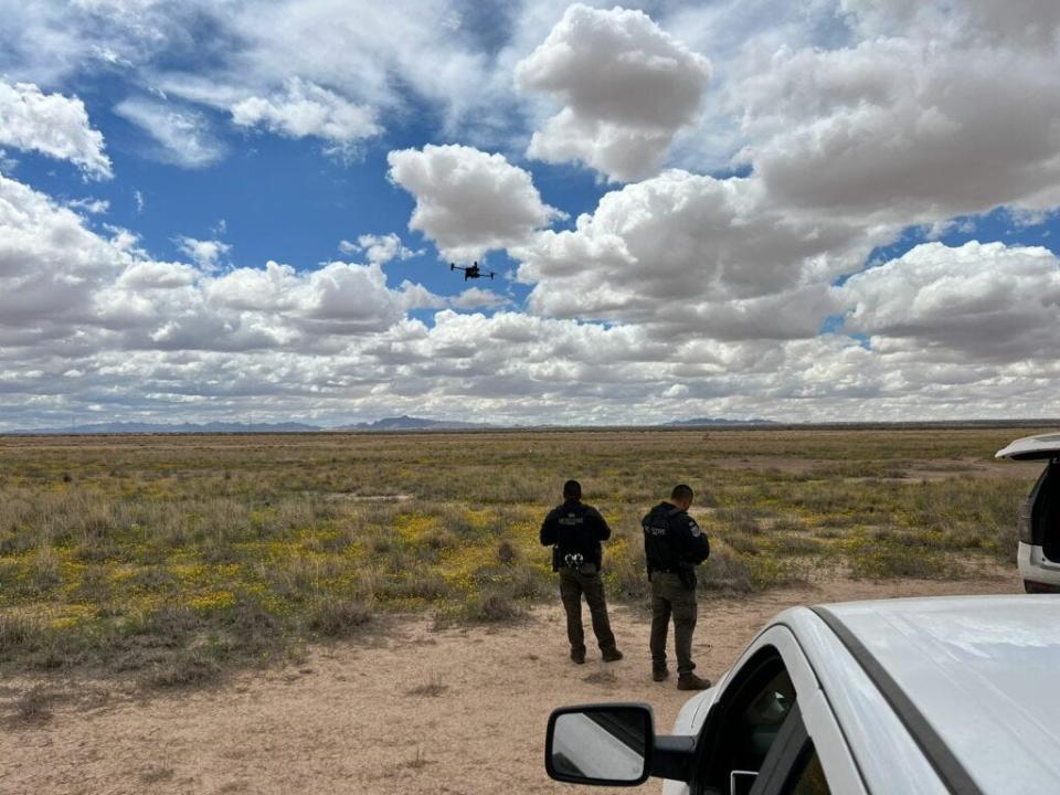 Chihuahua state investigators fly a drone on Tuesday during a search that located the body of missing-person Sayra Esmeralda Rios Gomez in the desert south of Juárez.
