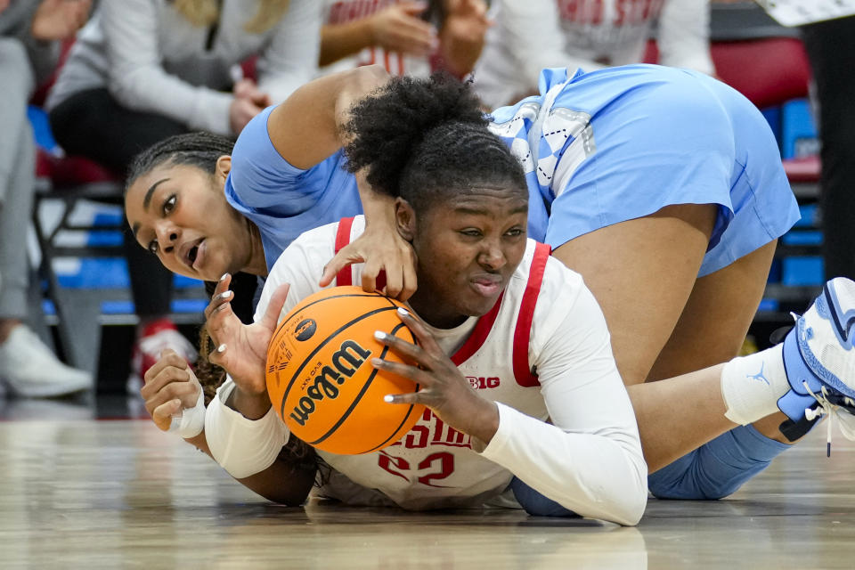 Ohio State forward Eboni Walker (22) grabs a loose ball under North Carolina guard Teonni Key (13) in the first half of a second-round college basketball game in the women's NCAA Tournament in Columbus, Ohio, Monday, March 20, 2023. (AP Photo/Michael Conroy)