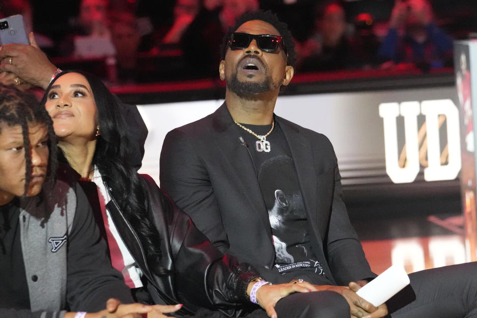 Former Miami Heat player looks up as his #40 jersey is lifted to the top of the Kaseya Area during a half time ceremony at an NBA basketball game against the Atlanta Hawks, Friday, Jan. 19, 2024, in Miami. (AP Photo/Marta Lavandier)