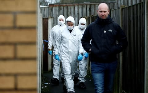 Forensic officers walk outside a property, which is being searched in connection with stabbing on London Bridge, in Stoke-on-Trent - Credit: Reuters&nbsp;