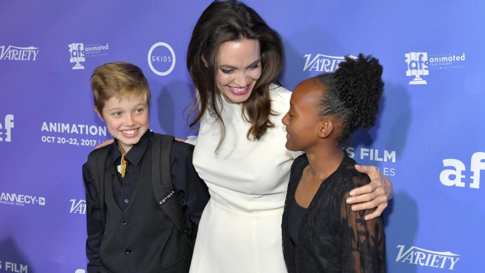 The 42-year-old actress was all smiles at the premiere of 'The Breadwinner,' holding hands with her two oldest daughters.