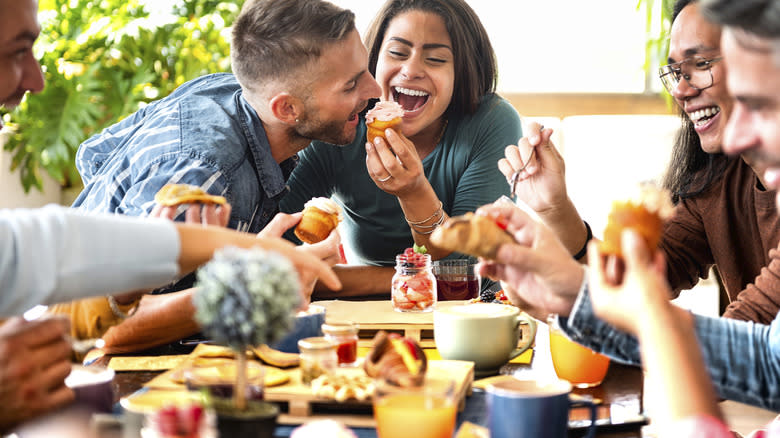 A happy group of people over breakfast