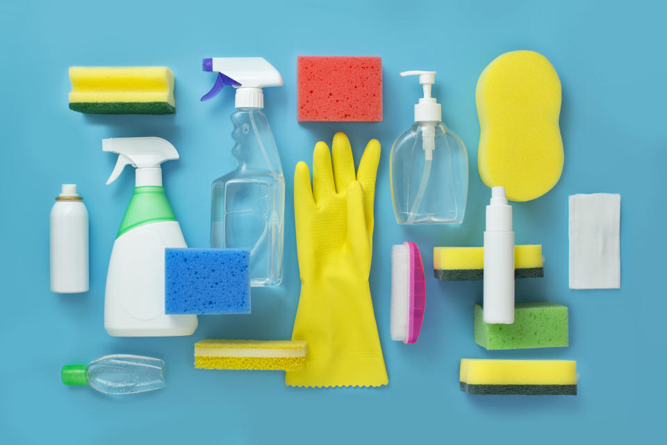 cleaning supplies on blue background, rubber gloves, sponge, spray bottles, soap, cleaning essentials on sale amazon canada