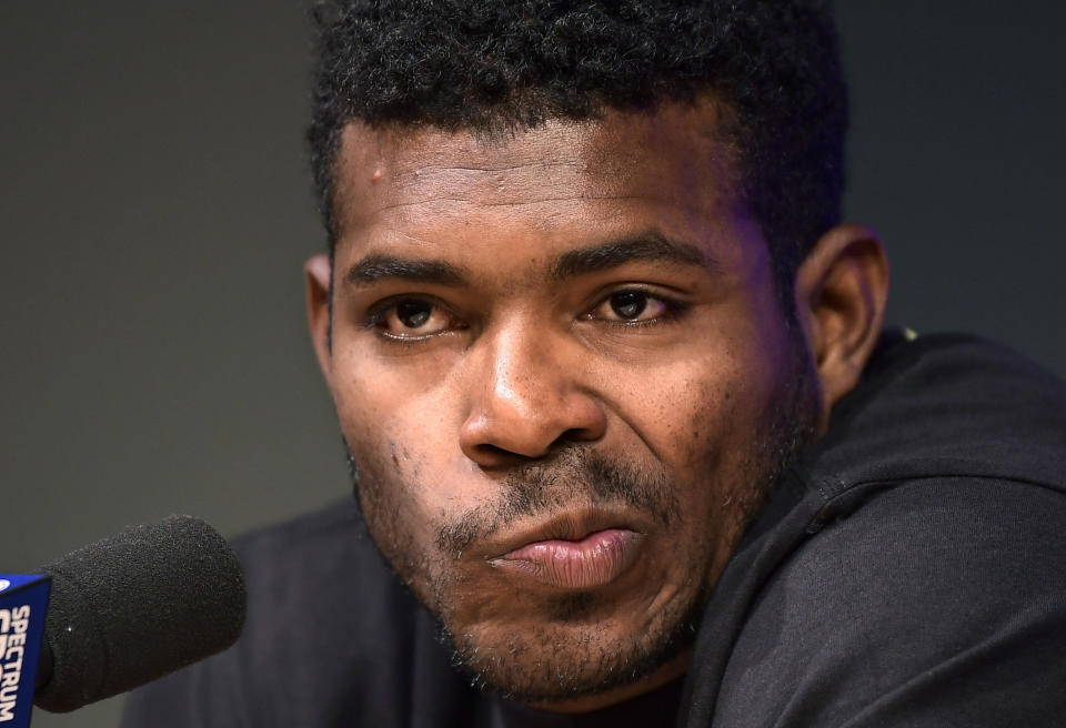 Cincinnati Reds' Yasiel Puig speaks to reporters prior to a baseball game against the Los Angeles Dodgers, Monday, April 15, 2019, in Los Angeles. (AP Photo/Mark J. Terrill)