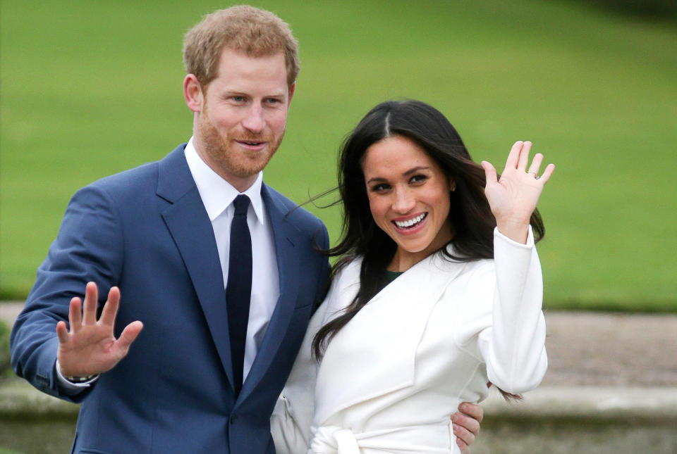 Image: Britain's Prince Harry and his fiancee Meghan Markle pose for a photograph in the Sunken Garden at Kensington Palace in west London following the announcement of their engagement. (Daniel Leal-Olivas / AFP - Getty Images file)