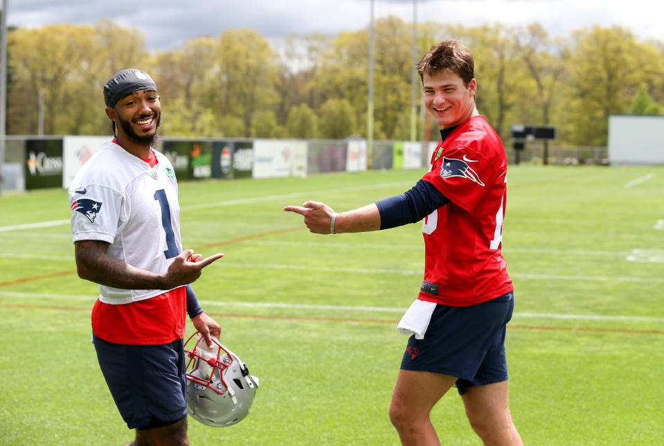 Foxborough, MA - May 11: New England Patriots rookies Ja'Lynn Polk and QB Drake Maye share a laugh at the team's 2024 Rookie Mini-Camp. (Photo by Jonathan Wiggs/The Boston Globe via Getty Images)