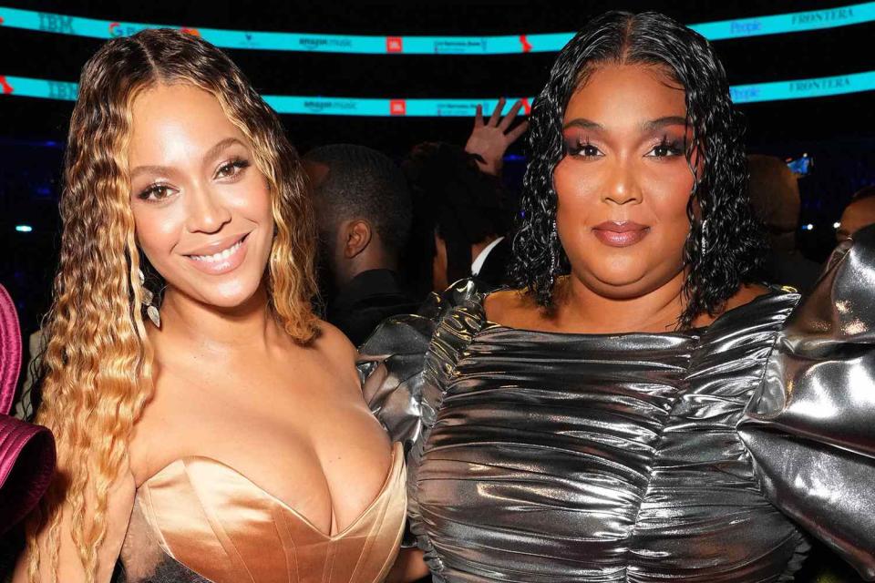 <p>Kevin Mazur/Getty </p> Beyoncé and Lizzo at the Grammys in February 2023