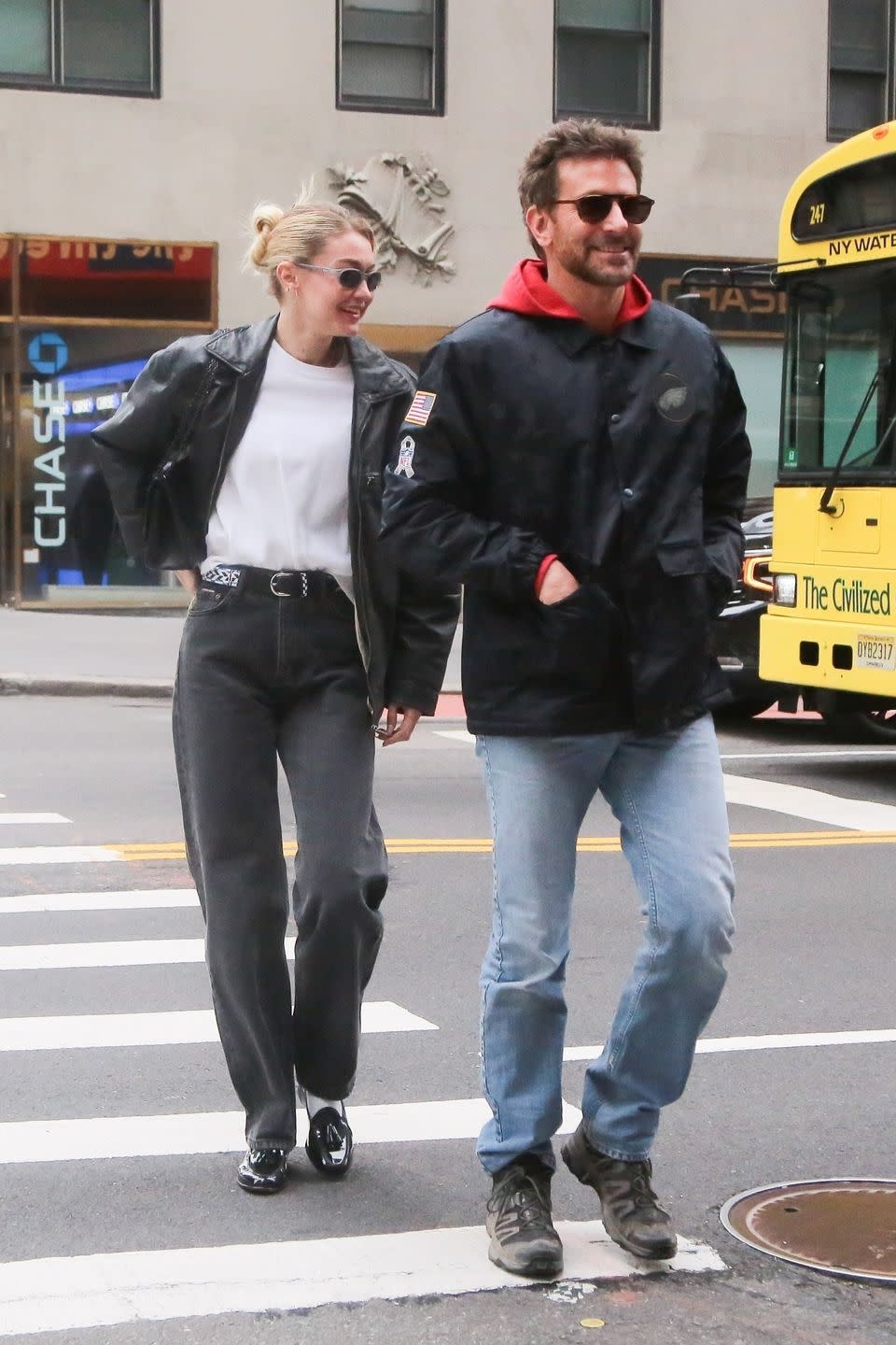 gigi and bradley walking on a street