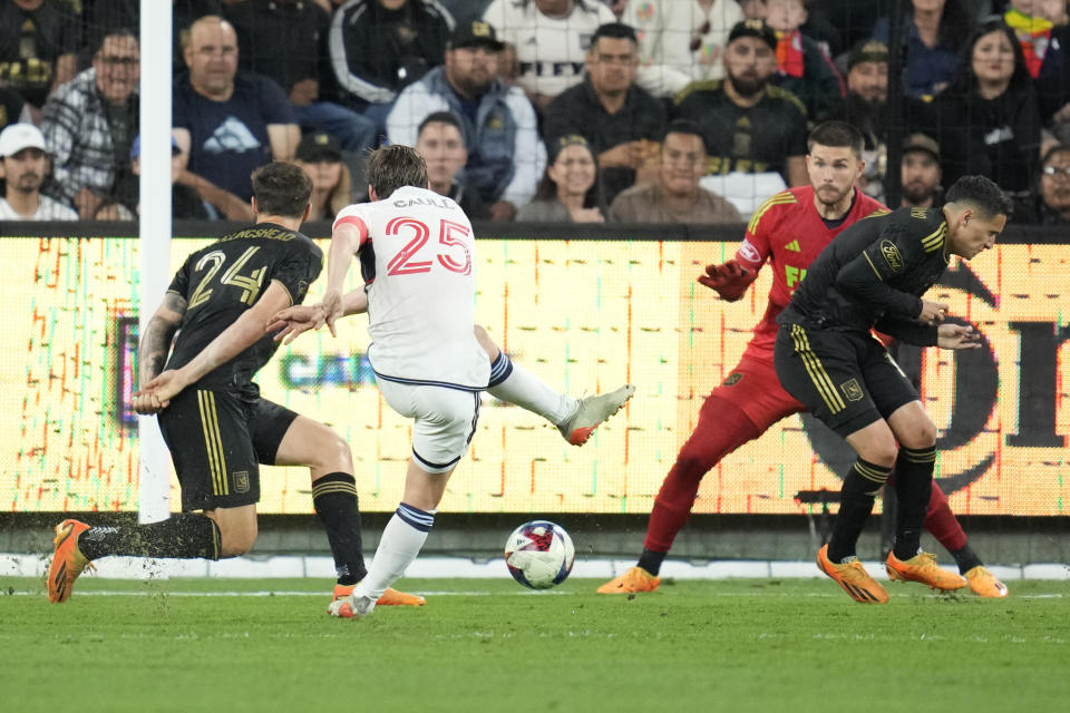 Vancouver Whitecaps midfielder Ryan Gauld (25) scores during the second half of an MLS soccer match against Los Angeles FC in Los Angeles, Saturday, June 24, 2023. (AP Photo/Ashley Landis)