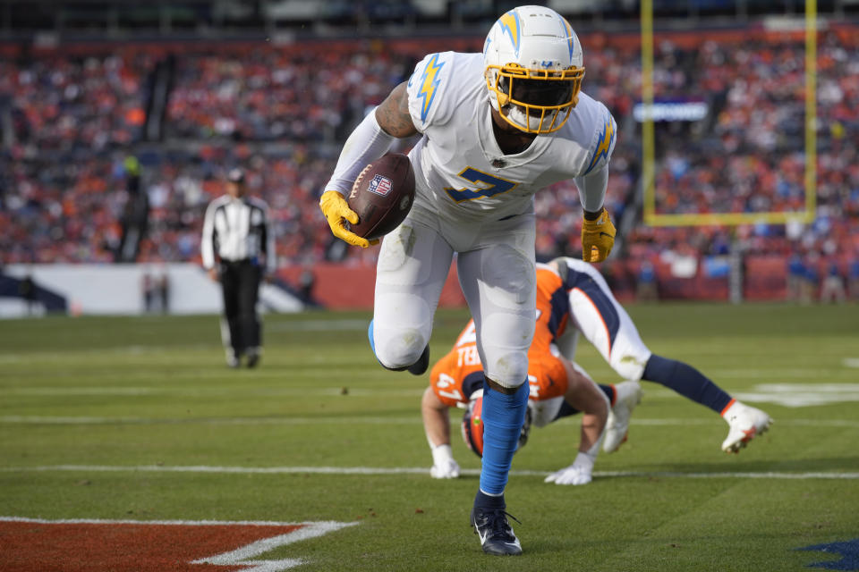 Los Angeles Chargers tight end Gerald Everett (7) scores a touchdown after making a catch against the Denver Broncos during the first half of an NFL football game in Denver, Sunday, Jan. 8, 2023. (AP Photo/David Zalubowski)