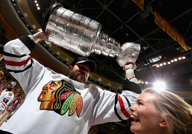 BOSTON, MA – JUNE 24: Viktor Stalberg #25 of the Chicago Blackhawks celebrates with his girlfriend as he hoists the Stanley Cup after his team defeated the Boston Bruins 3-2 in Game Six of the 2013 Stanley Cup Final at TD Garden on June 24, 2013 in Boston, Massachusetts. The Chicago Blackhawks won the series 4-2 to win the Stanley Cup. (Photo by Dave Sandford/NHLI via Getty Images)