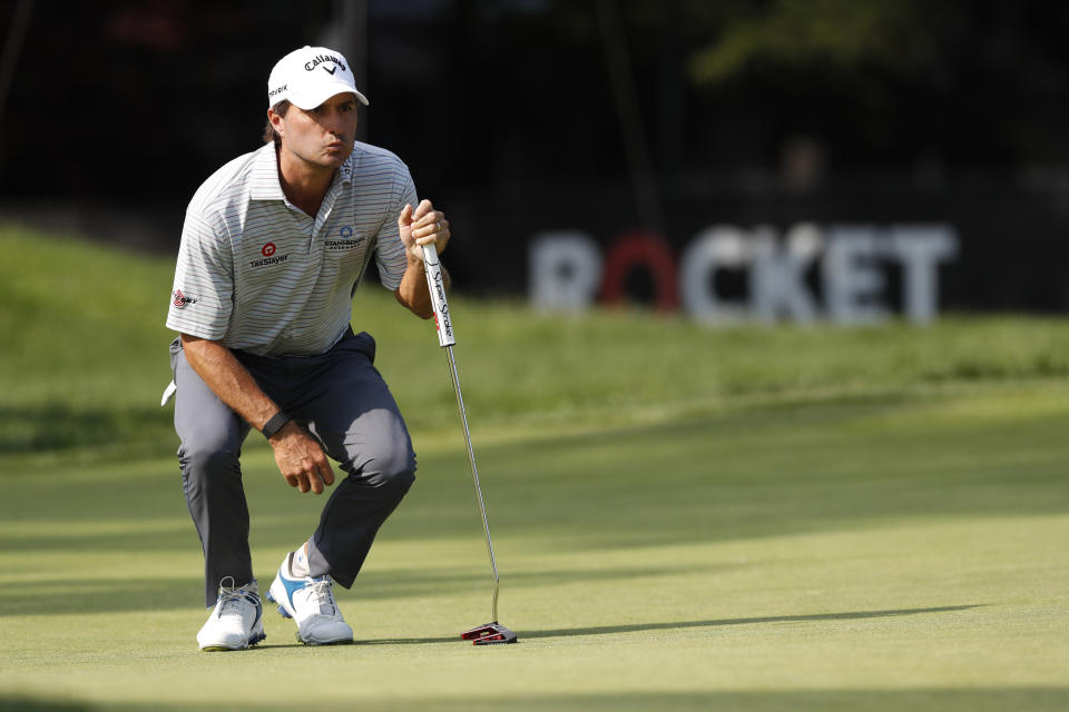 Kevin Kisner eyes his putt on the ninth green during the first round of the Rocket Mortgage Classic golf tournament Thursday, July 2, 2020, at Detroit Golf Club in Detroit. (AP Photo/Carlos Osorio)