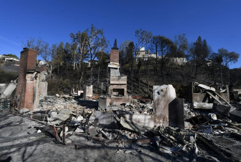 A burnt out house is seen after the Skirball wildfire swept through the exclusive enclave of Bel Air, California, on December 7, 2017