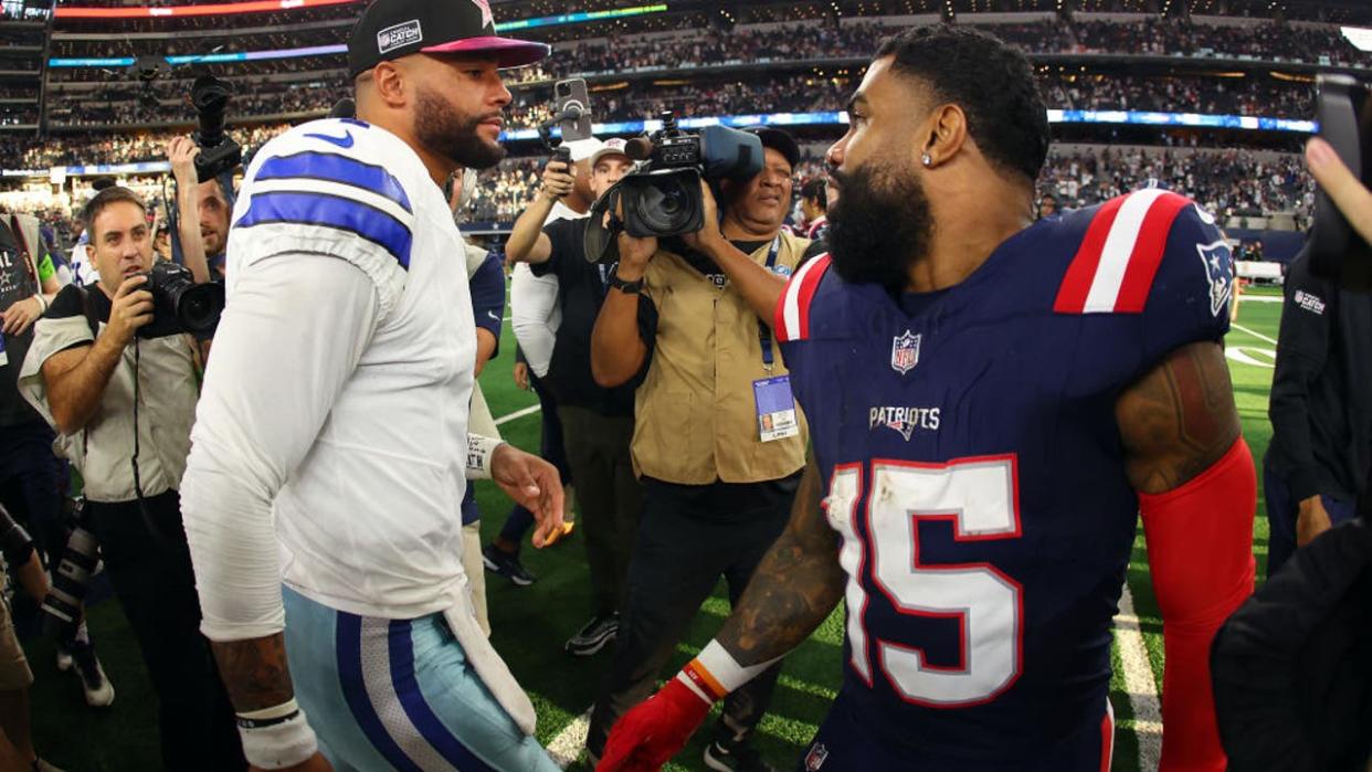 <div>ARLINGTON, TEXAS - OCTOBER 01: Dak Prescott #4 of the Dallas Cowboys and Ezekiel Elliott #15 of the New England Patriots meet on the field after the game at AT&T Stadium on October 01, 2023 in Arlington, Texas. (Photo by Richard Rodriguez/Getty Images)</div>