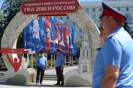 FILE PHOTO: Cossacks guard a street ahead of the upcoming 2018 FIFA World Cup in Rostov-on-Don, Russia June 7, 2018. REUTERS/Sergey Pivovarov/File Photo