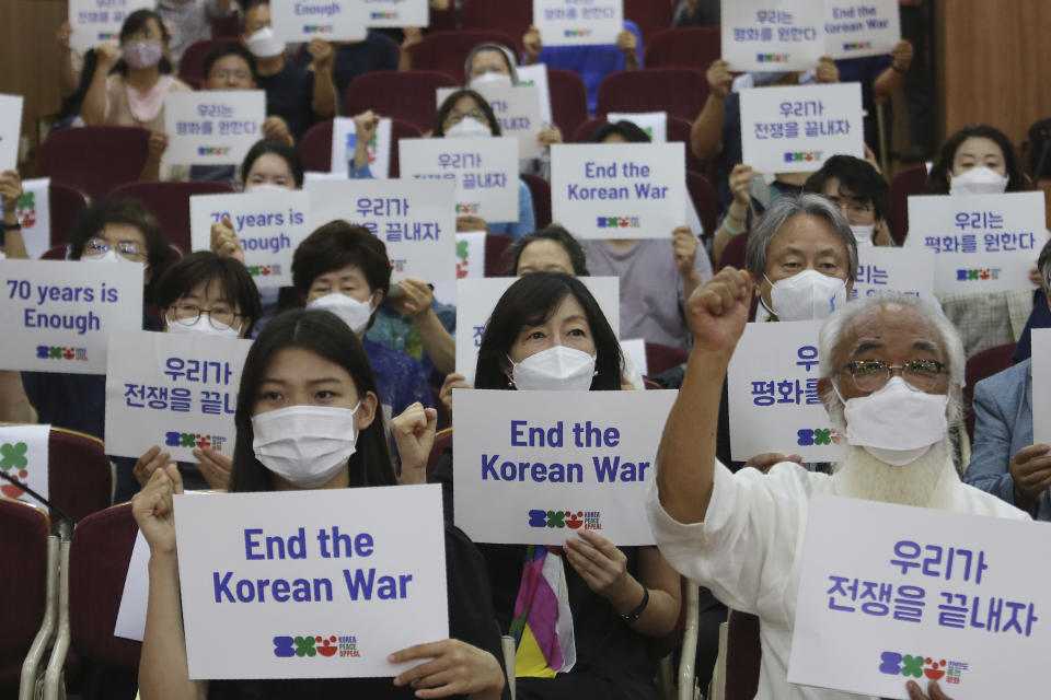 Anti-war activists shout slogans during a press conference to demand the peace on the Korean peninsula on the eve of the 70th anniversary of the outbreak of the Korean War in Seoul, South Korea, Wednesday, June 24, 2020. North Korean leader Kim Jong Un suspended his military's plans to take unspecified retaliatory action against South Korea, state media said Wednesday, possibly slowing a pressure campaign against its rival amid stalled nuclear negotiations with the Trump administration. The sign reads "Let us end the war." (AP Photo/Ahn Young-joon)