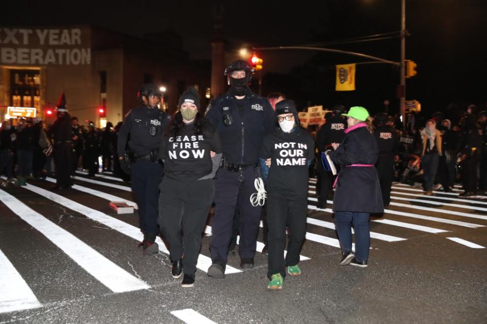 Those arrested were brought to MTA buses to be transported for booking. William C Lopez/New York Post