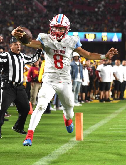 Los Angeles, California October 21, 2022-Garfield quarterback Damian Cabrera scores on a two-point conversion.