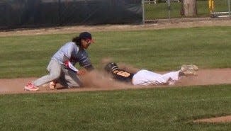 Erie Mason's Anderson Moore slides into second base Wednesday.