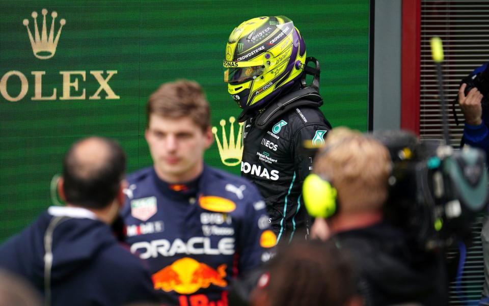 Mercedes' Lewis Hamilton walks past Red Bull Racing's Max Verstappen after the Emilia Romagna Grand Prix at the Autodromo Internazionale Enzo e Dino Ferrari circuit in Italy, better known as Imola - PA