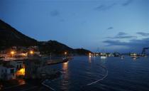 The capsized cruise liner Costa Concordia lies on its side next to Giglio Island September 16, 2013. REUTERS/Tony Gentile