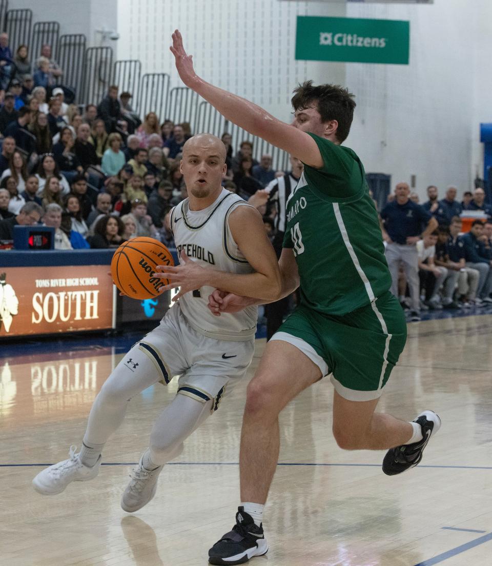 Freehold’s Christian DeGiso works in against Ramapo’s Peyton Seals. Ramapo Boys Basketball vs Freehold Borough for NJSIAA Group 3 Title inToms River, NJ on March 10, 2024.