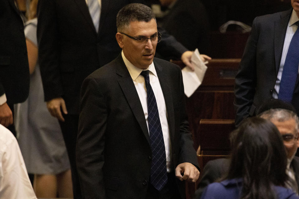 In this Thursday, Oct. 3, 2019 photo, Gideon Saar, attends the swearing-in of the new Israeli parliament in Jerusalem. With a simple tweet, Gideon Saar did what no Israeli politician from the ruling Likud party has done in more than a decade -- openly challenge Prime Minister Benjamin Netanyahu. The brazen move against the long-serving Israeli leader has solidly positioned the 52-year-old Saar as the leading candidate to replace Netanyahu, who is fighting for his survival amid a pending corruption indictment and post-election political paralysis. (AP Photo/Ariel Schalit)