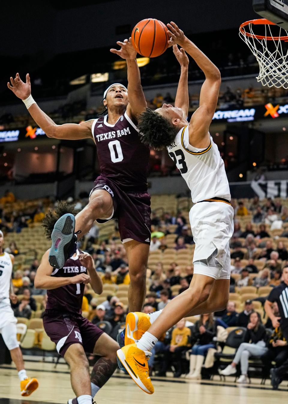 Texas A&M guard Aaron Cash (0) blocks the shot of Missouri forward Trevon Brazile (23) during a game Saturday at Mizzou Arena.