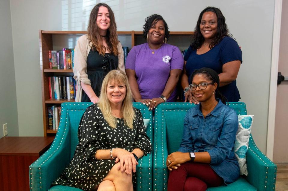 Staff of the Gulf Coast Center for Nonviolence pose for a portrait in Biloxi on Wednesday, July 24, 2024. From left, first row: Stacey Riley, Chief Executive Officer and Patricia Boyou, Chief Clinical Officer. From left, second row: Melissa Galatas, Justice for Families Program Manager, Myia Lane, Client Services Manager, and Nateshia Stubbs, Housing Program Manager.