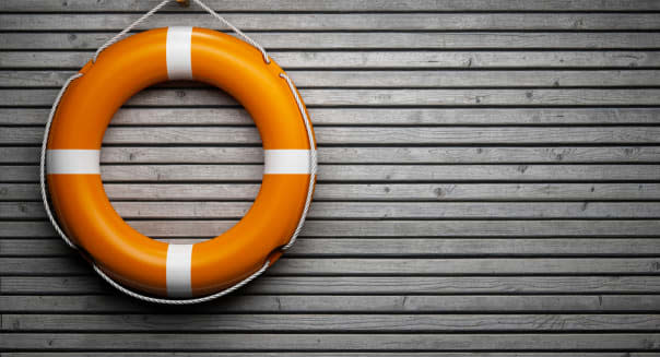 Lifebuoy on wooden wall
