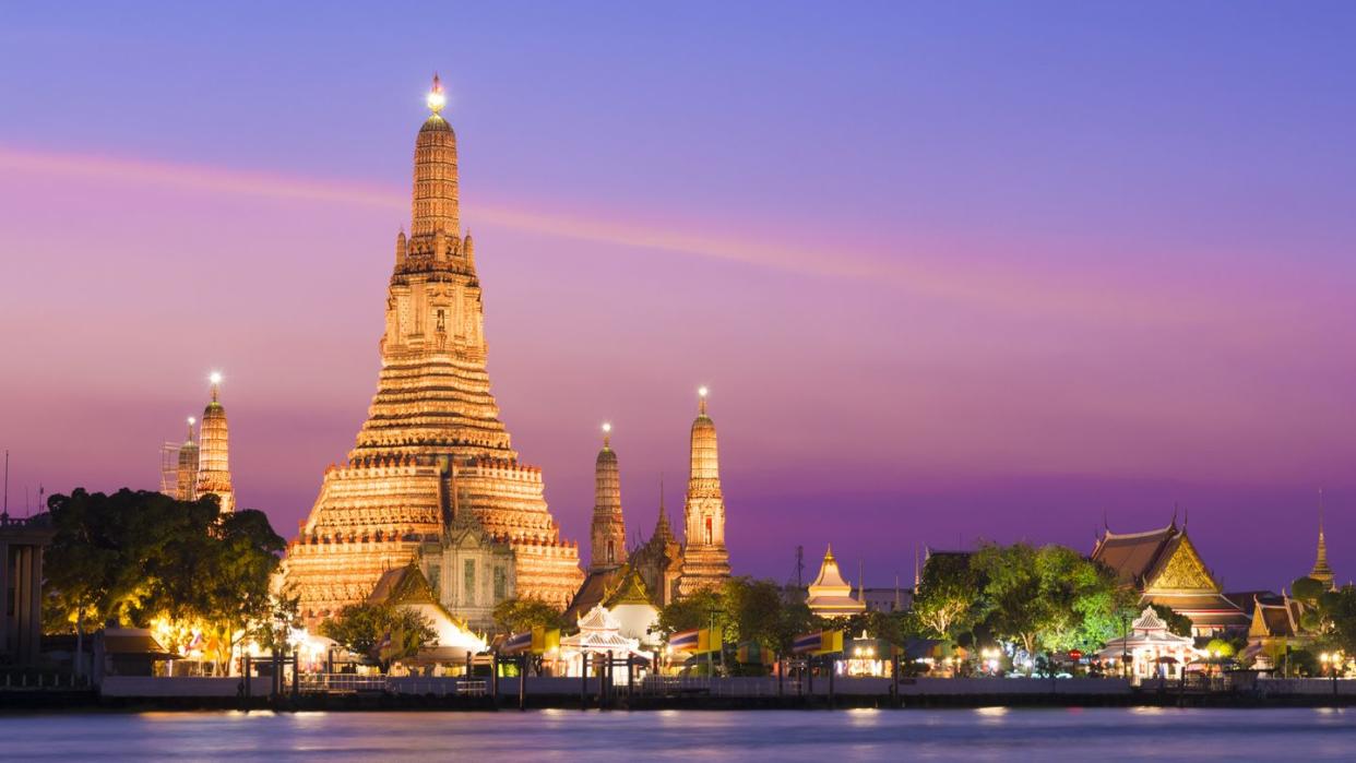 wat arun temple at sunset in bangkok, thailand