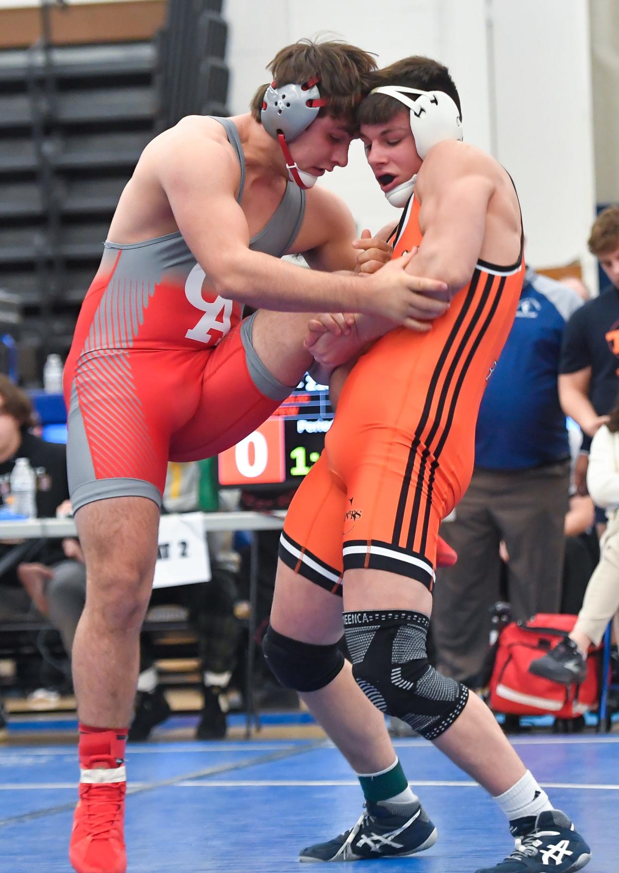 Churchville-Chili’s Coy Raines, right, wrestles Canandaigua’s Mason Depew in the final of the 215-pound weight class during the Monroe County Wrestling Championships, Saturday, Dec. 16, 2023.
