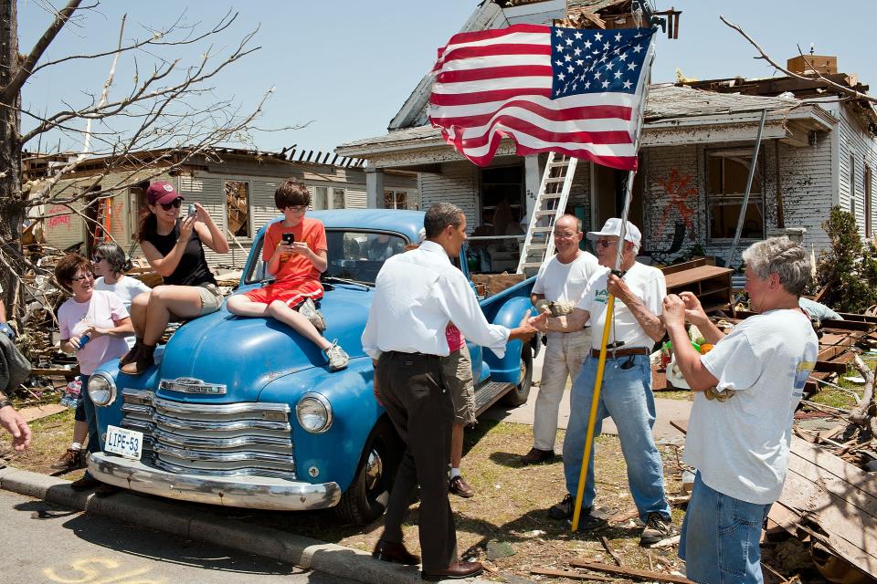 President Obama greets a tornado survivor on May 29, 2011