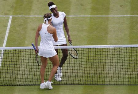 Britain Tennis - Wimbledon - All England Lawn Tennis & Croquet Club, Wimbledon, England - 5/7/16 USA's Venus Williams shakes hands with Kazakhstan's Yaroslava Shvedova after winning their match REUTERS/Andrew Couldridge