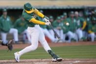 Oakland Athletics' Tyler Nevin hits an RBI single against the Pittsburgh Pirates during the second inning of a baseball game in Oakland, Calif., Tuesday, April 30, 2024. (AP Photo/Jeff Chiu)