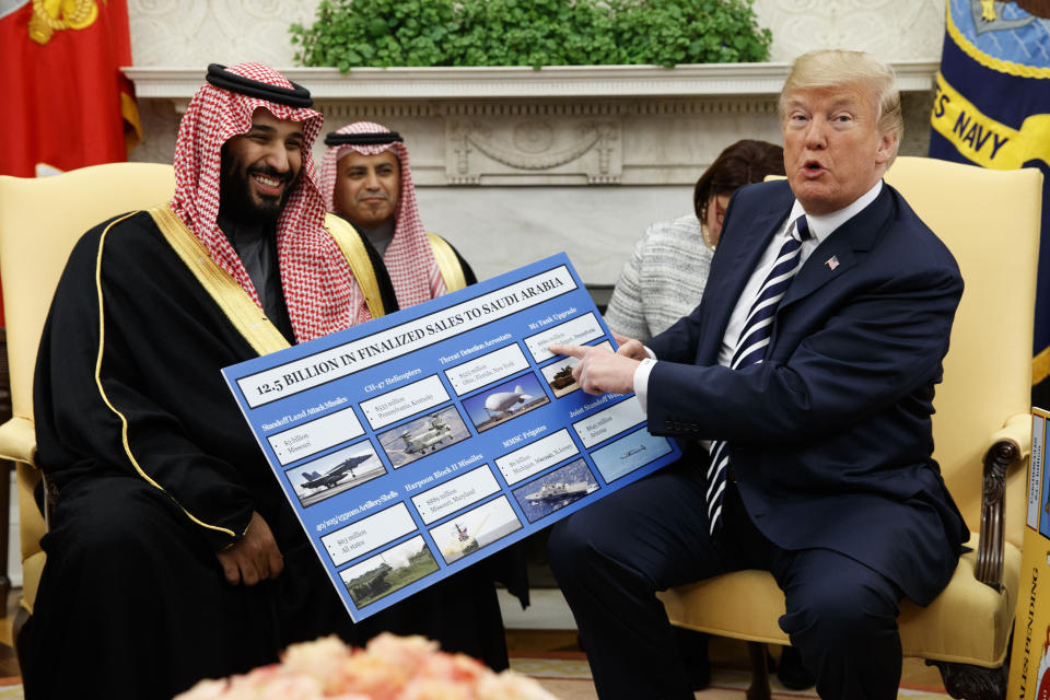 Trump holds a chart highlighting arms sales to Saudi Arabia during a meeting with Crown Prince Mohammed bin Salman in the Oval Office in Washington in March. (Photo: Evan Vucci/AP)