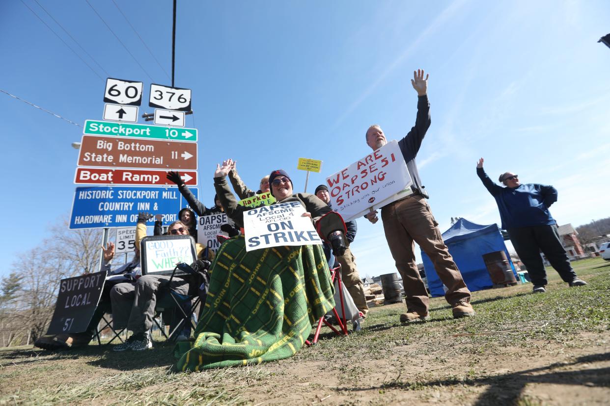 Members of OAPSE 51 picket on the Commons in McConnelsville Wednesday. The union represents support staff at Morgan Local Schools.